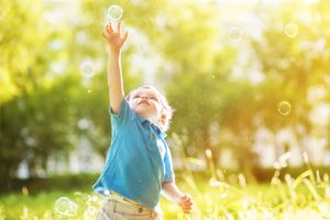 Little boy with soap bubbles
